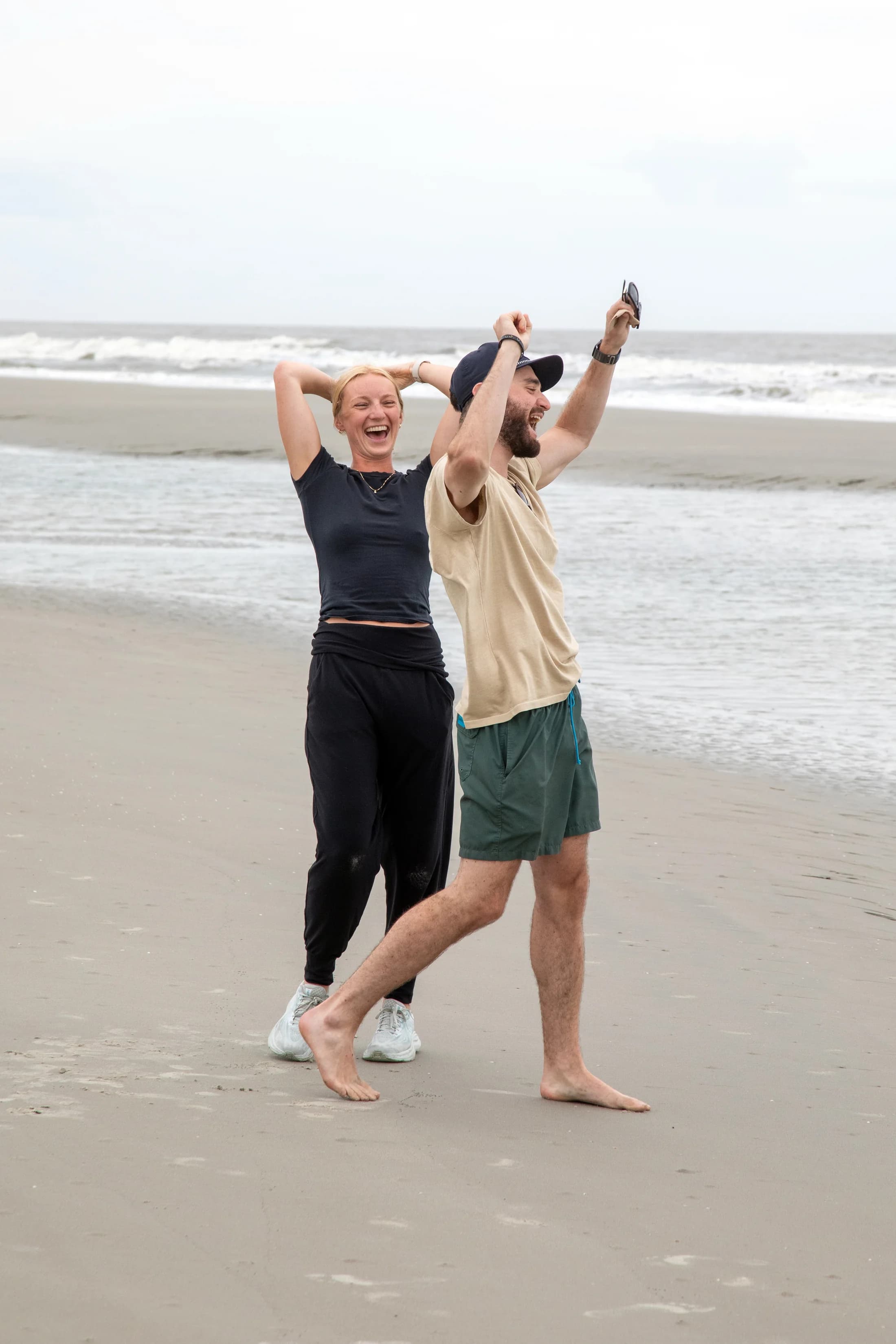 Molly and Mitch celebrating together on the beach