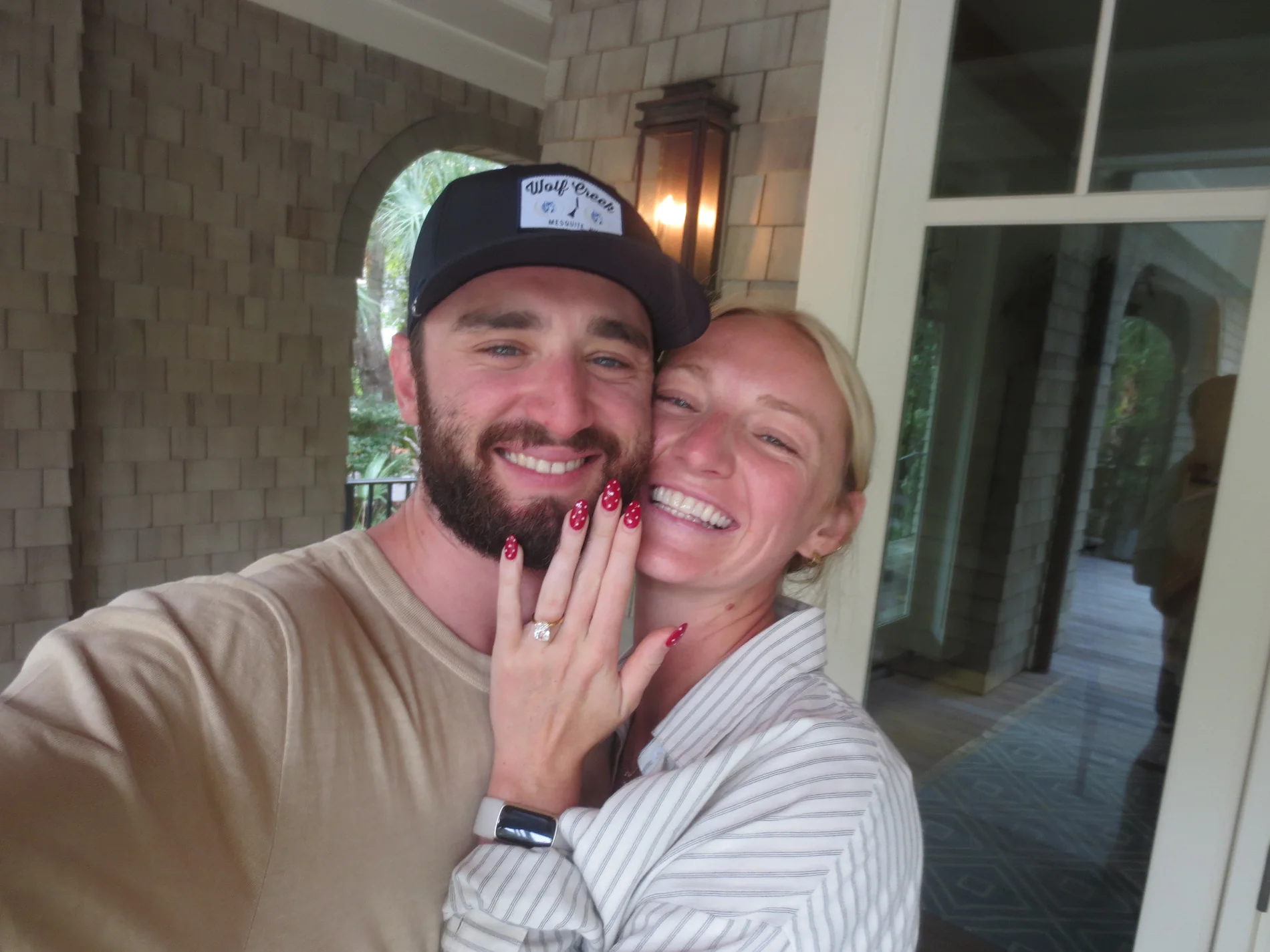 Molly and Mitch smiling after their engagement